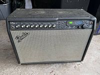Front view of Fender Cyber-Twin amplifier showing grille cloth, logo and full control panel