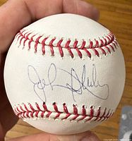 Autographed side of baseball showing John Sterling signature