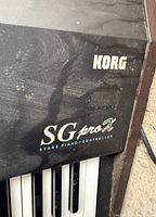 Close-up of Korg SG proX logo on instrument corner