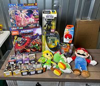 Group shot showing all boxed items and plush dolls