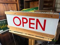Front view showing entire illuminated sign and lettering
