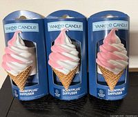 Front view of three boxed ice-cream cone diffusers