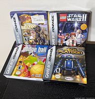 Four boxed Game Boy Advance games front view