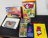Both boxed games with cartridges and booklets displayed on table