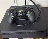Top view of PS4 Slim with controller on top