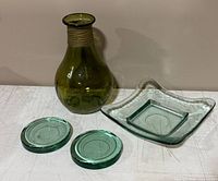 Group shot of bottle, plate and two coasters