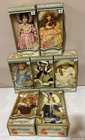 Group shot of all seven boxed dolls