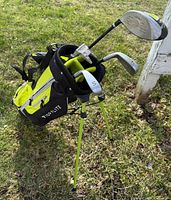 Full view of neon yellow/black Top Flite stand bag with clubs inserted
