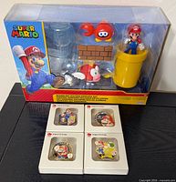 Front view of boxed diorama set with four pin badge boxes