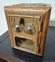 Front view showing brass combination door and window