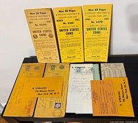 Overall view of three pamphlets, envelopes, letter and forms