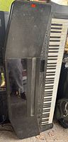 Full view of Yamaha Clavinova digital piano standing upright