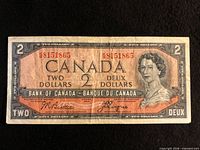 Obverse of the 1954 Canada $2 banknote showing portrait, serial number 8151865, signatures