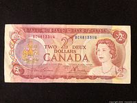 Full view of 1974 $2 banknote front, showing portrait, denomination and serial
