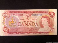 Obverse of $2 banknote showing serial number and portrait