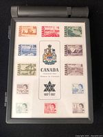 Closed plastic case displaying 12 Centennial stamps