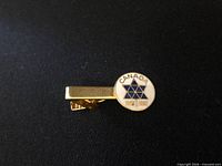 Front view showing Canada Centennial emblem and gold-tone clip