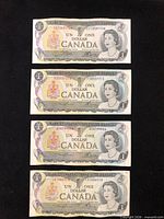 Obverse view of four 1973 Canada $1 notes