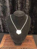 Full view of necklace displayed on bust