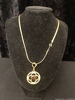 Full view of necklace on display stand