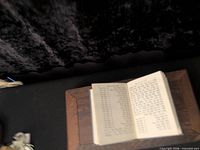 Closed prayer book on stand showing size and cover condition