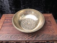 Top view showing carved mandala inside brass bowl