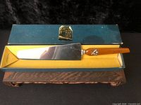 Full view of cake knife resting in original box