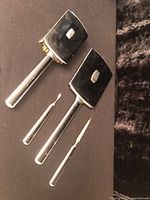 Full set showing mirror, brush, nail file, cuticle tool