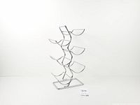 Full view of chrome 6-bottle wine rack upright