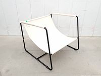 three-quarter view showing frame and canvas seat