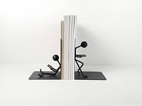 Pair of bookends holding magazines, side view