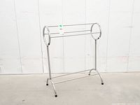 Front angled view of chrome rack showing circular sides and overall structure