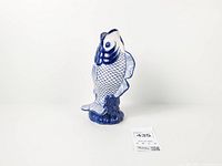 Front view of blue and white ceramic koi fish vase