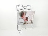 Front view with magazine to illustrate pocket depth and wavy design