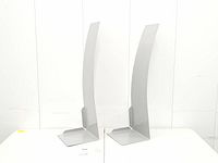 Front view of both curved metal wall shelves standing upright