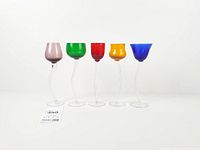 Front view of five multicolored swirl stem glasses