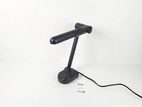 Full view of folded desk lamp showing overall design