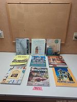 All nine books displayed on tabletop, covers visible