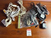 Group view of all cords and adapters on table