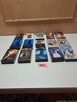 Overhead view of 13 VHS tapes on table