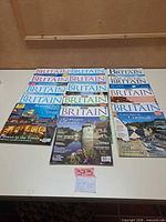 All fourteen Britain / Discover Britain magazines laid out on table