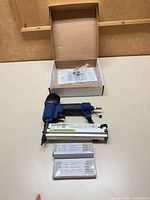 nailer, brad boxes, manual and packaging laid out