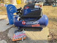 Compressor with hose and fittings set displayed