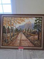 Full view of framed oil landscape painting