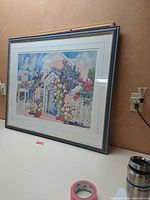 Framed signed limited-edition house and garden print under glass