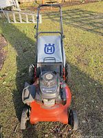 Full top view of mower showing deck, engine, bag and handle