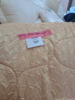 Full view of quilted bedspread showing colour and texture