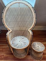 Front view of rattan peacock chair and matching ottoman