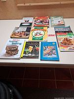 Overview of all ten books laid out on table