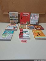 All ten paperbacks laid out on table